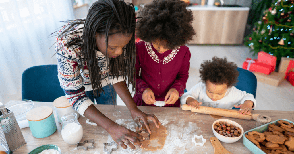 Three young children baking