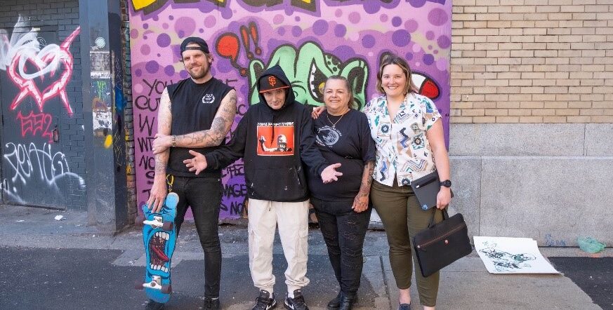 Pictured here are some of the team members including Dr Sofia Bartlett, the Interim Scientific Director of Clinical Prevention Services at the BC Centre for Disease Control, Pam Young from Unlocking the Gates which is a peer support organization for people who are being released from custody in the BC Provincial Corrections, and Trey Helten and Smokey-Devil, local graffiti artists (Smokey D is a self-identified underworld street reporter, currently receiving care for hepatitis thanks to this program).