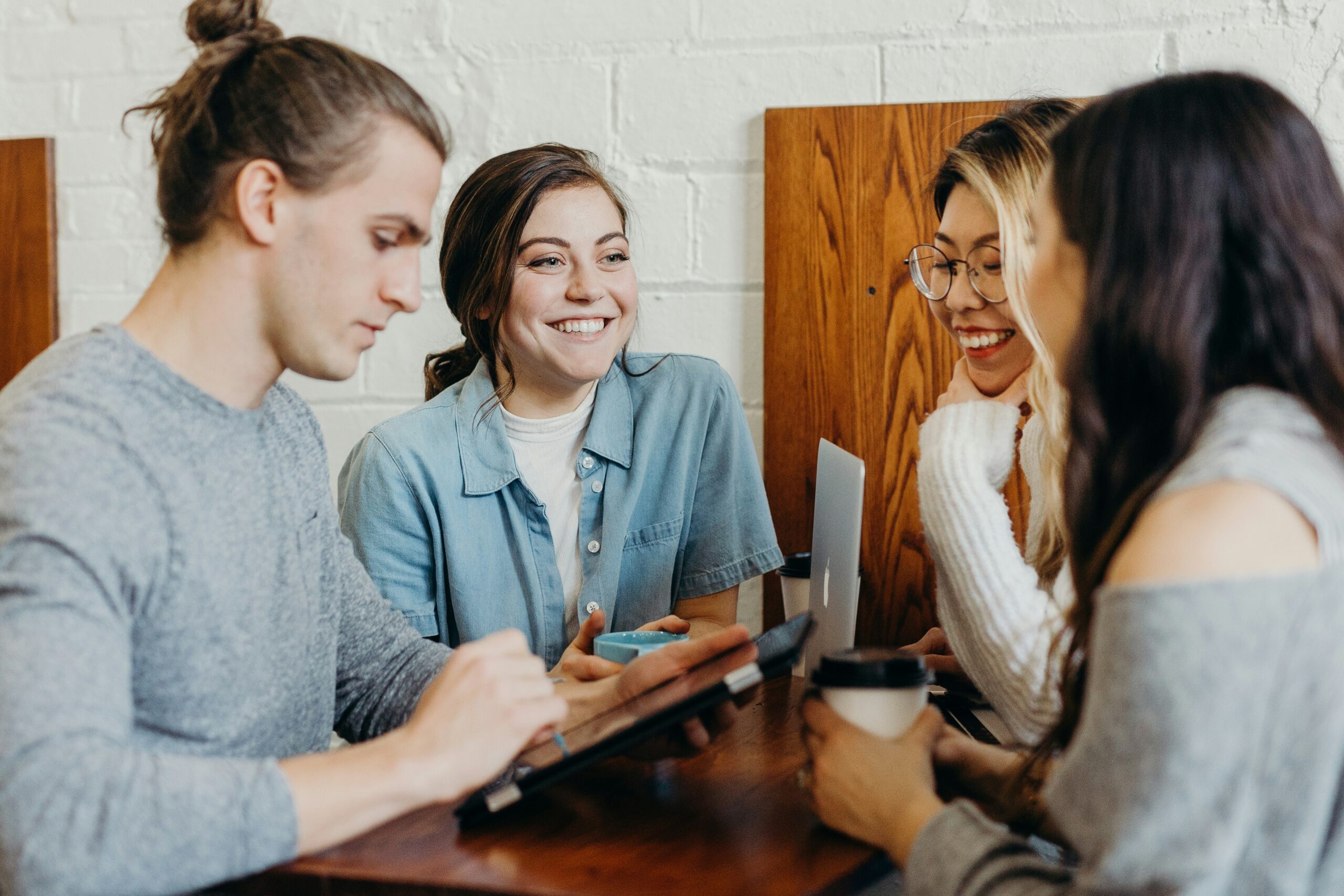 A group of friends sitting at a table talking