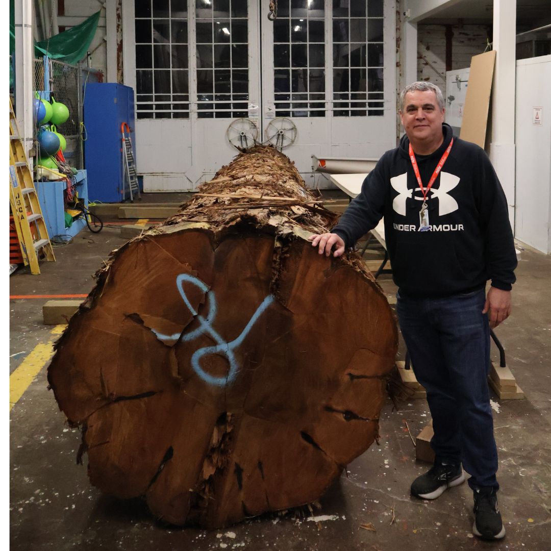 Coast Salish artist Jody Sparrow with log
