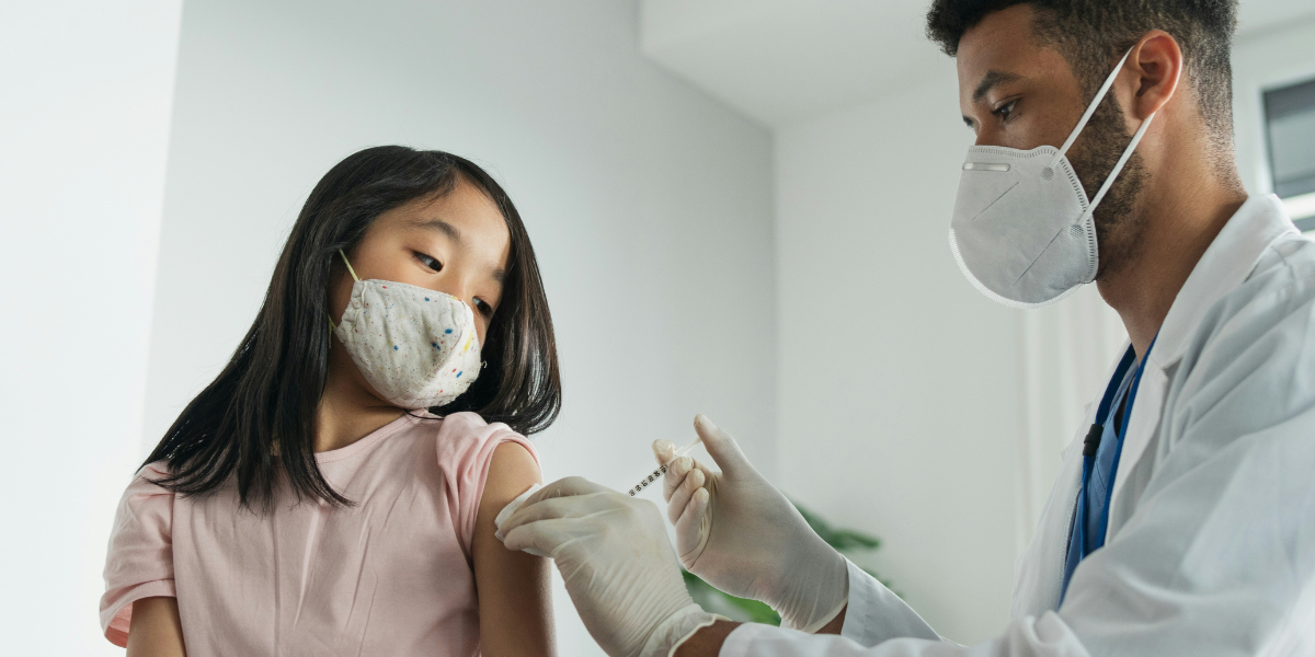 A child receiving a life-saving immunization from a doctor in British Columbia